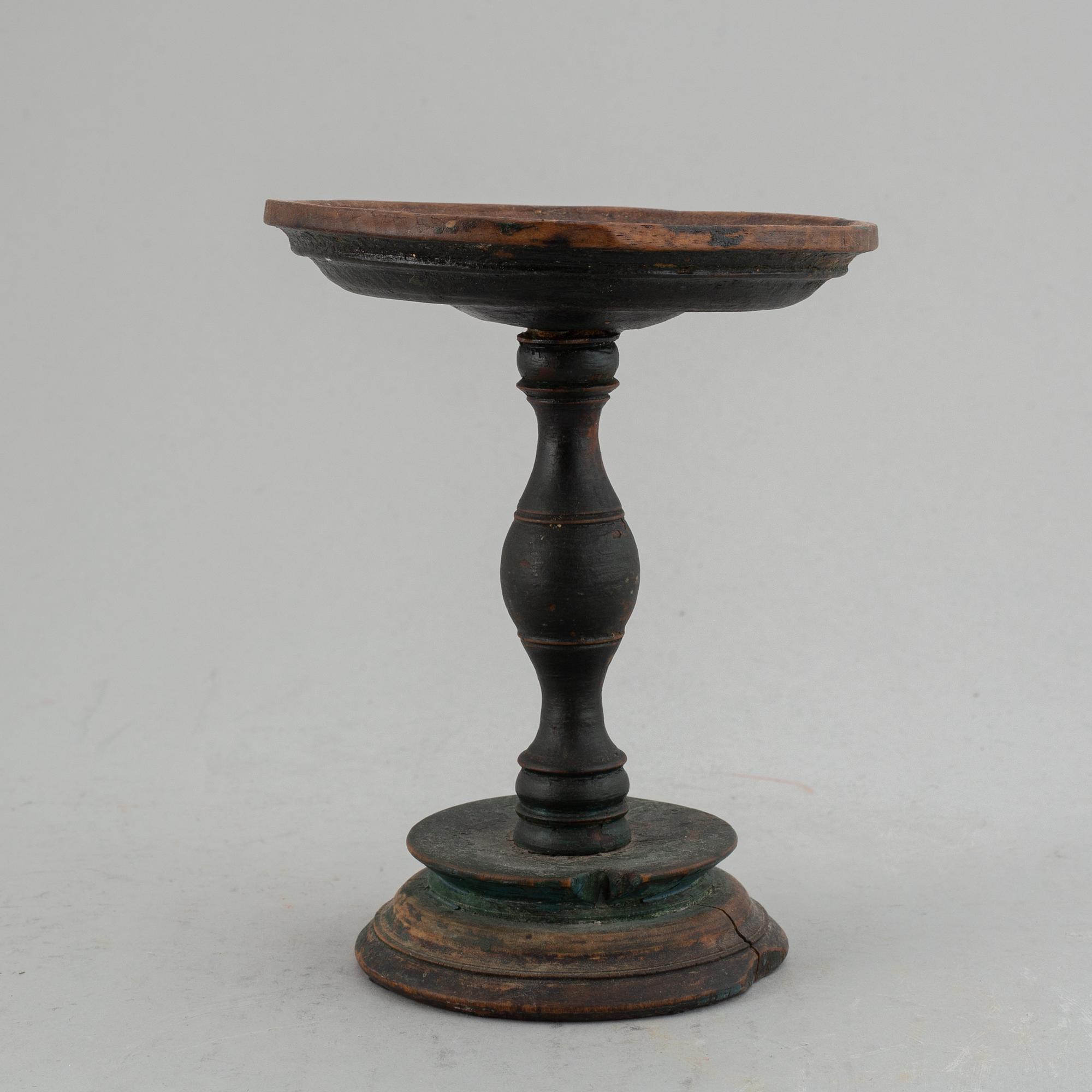 A 19th century wooden butter stand.