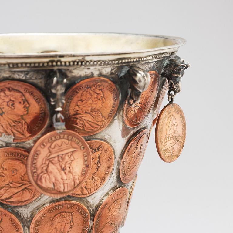 A Swedish 18th century parcel-gilt silver coin-beaker.