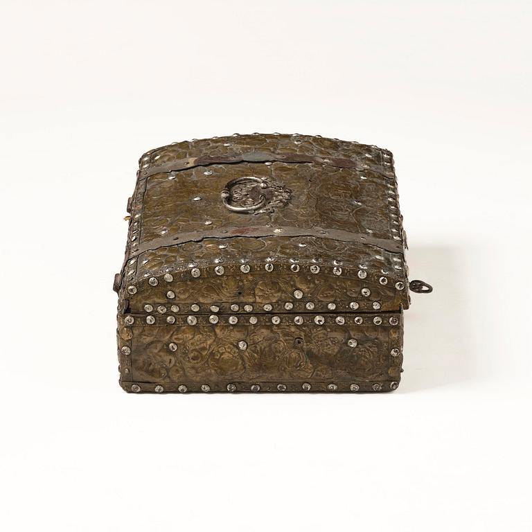 A presumably German baroque repoussé brass writing box, late 17th century.