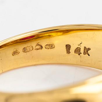 A 14K gold ring, set with an oval-cut ruby and diamonds totaling approx. 0.06 ct. Finland, 1999.