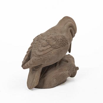 Tyra Lundgren, a stoneware sculpture of a woodpecker, executed in her own studio.