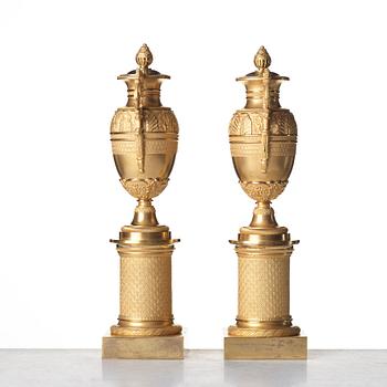 A pair of French Empire candlesticks, early 19th century.