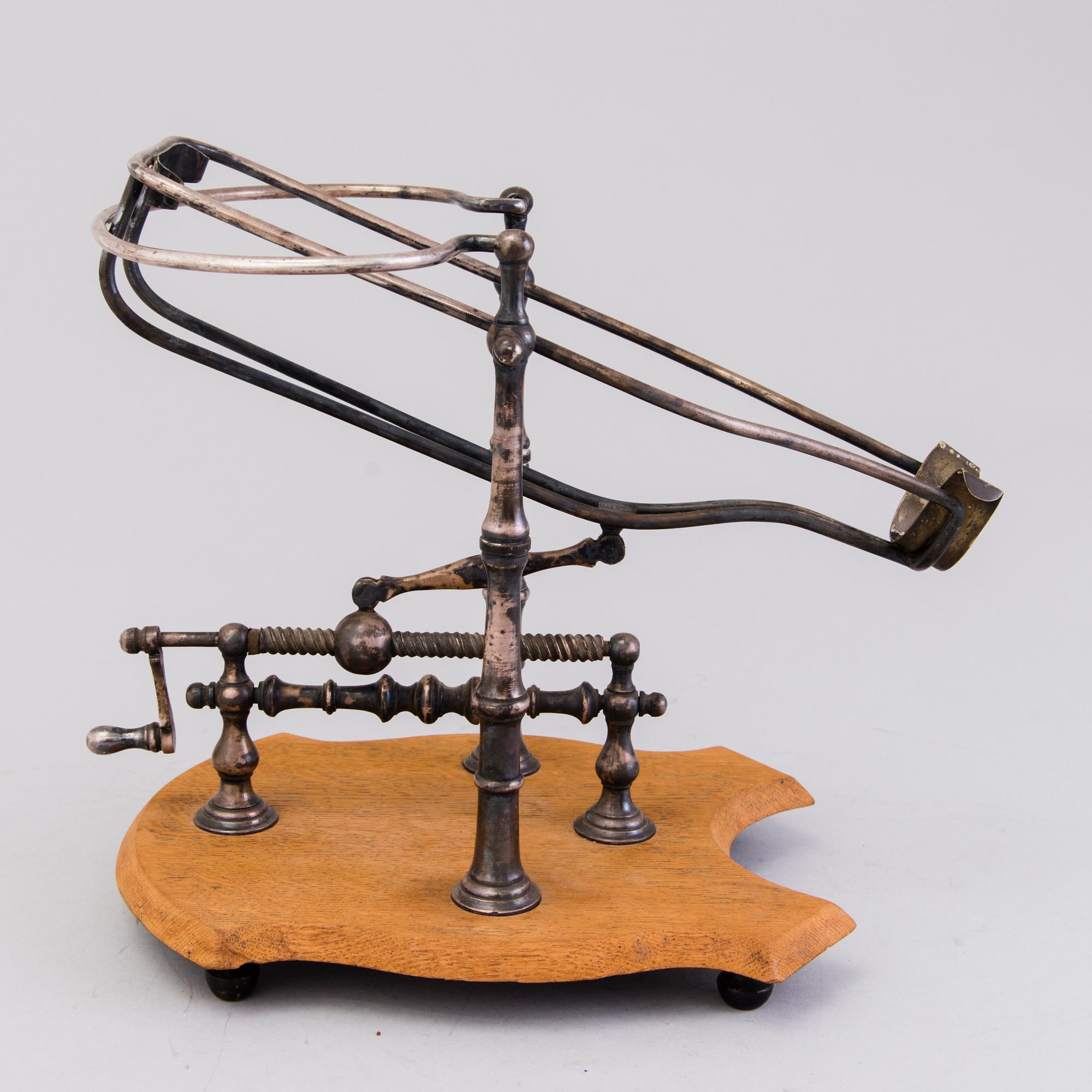Mechanical Wine Decanting Cradle, around 1900.