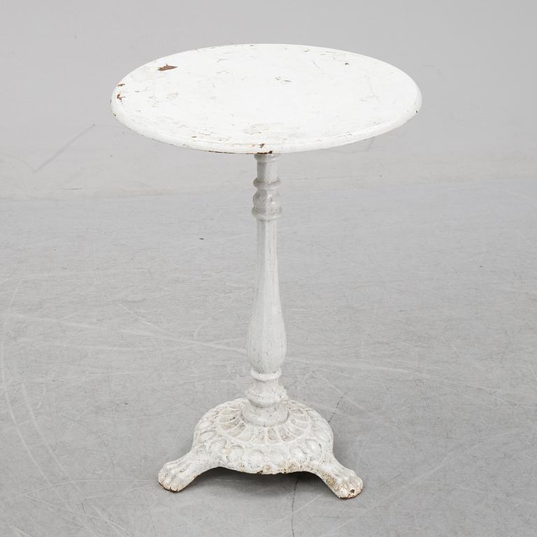 A cast iron garden table, early 20th century.