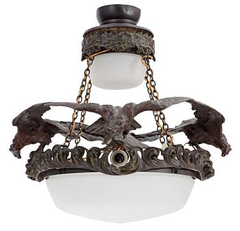 A Swedish Art Nouveau patinated bronze and patinated metal hanging lamp, reportedly designed by Ruth Milles.