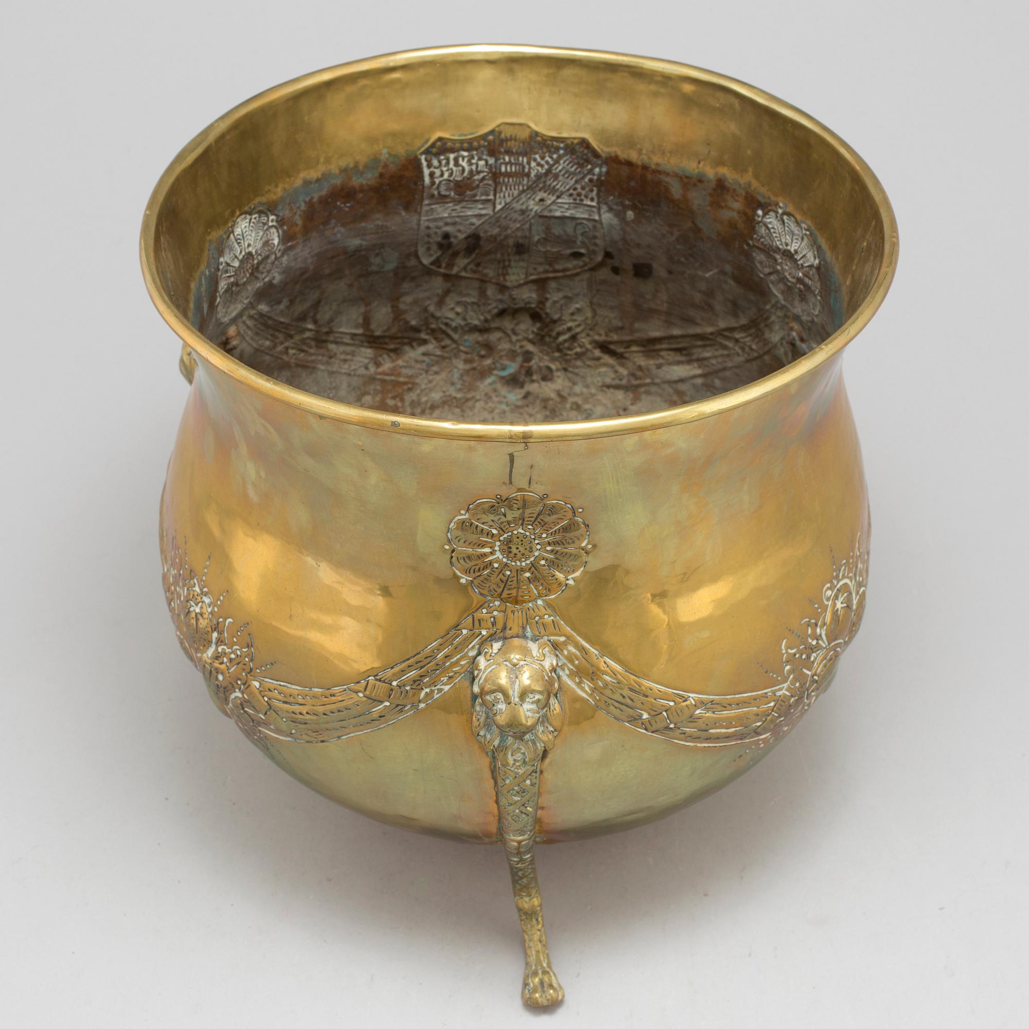 An 18th century brass flower pot.