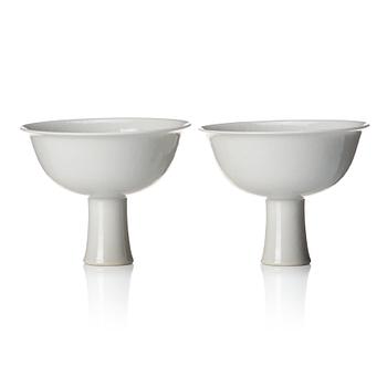 1015. A pair of white glazed anhua stemcups, Qing dynasty, 19th Century.