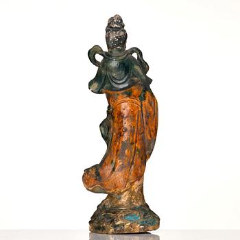 A green and yellow glazed Guanyin figure, late Ming dynasty/Qingdynasty.