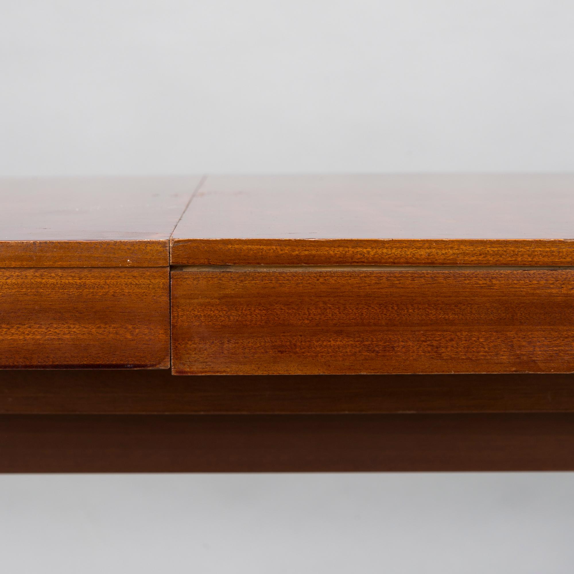 A mid 20th century conference table / dinner table marked Paul Boman.