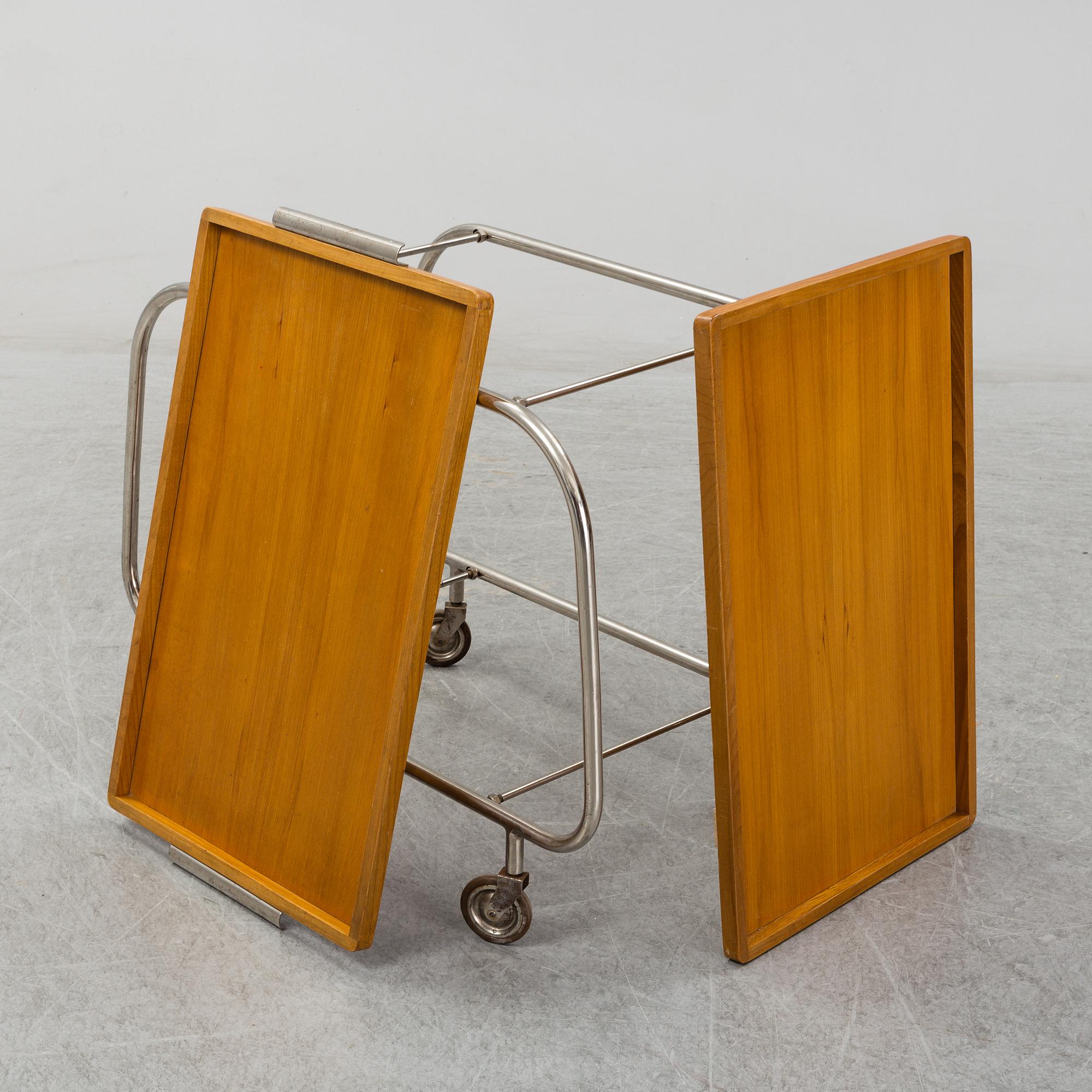 An elm and tubular steel drinks trolley, 1930's.