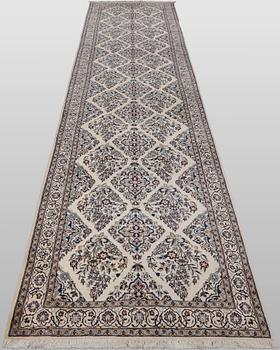 A Nain part silk carpet, 408 x 98 cm.