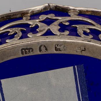 A pair of English 18th century silver and blue glass salt-cellars, unidentified makers mark, London 1767.