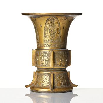 A parcel gilt/gold splashed bronze vase, Gu, 17/18th century.