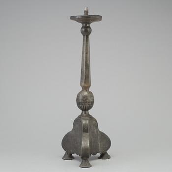 A 17th century pewter candlestick.