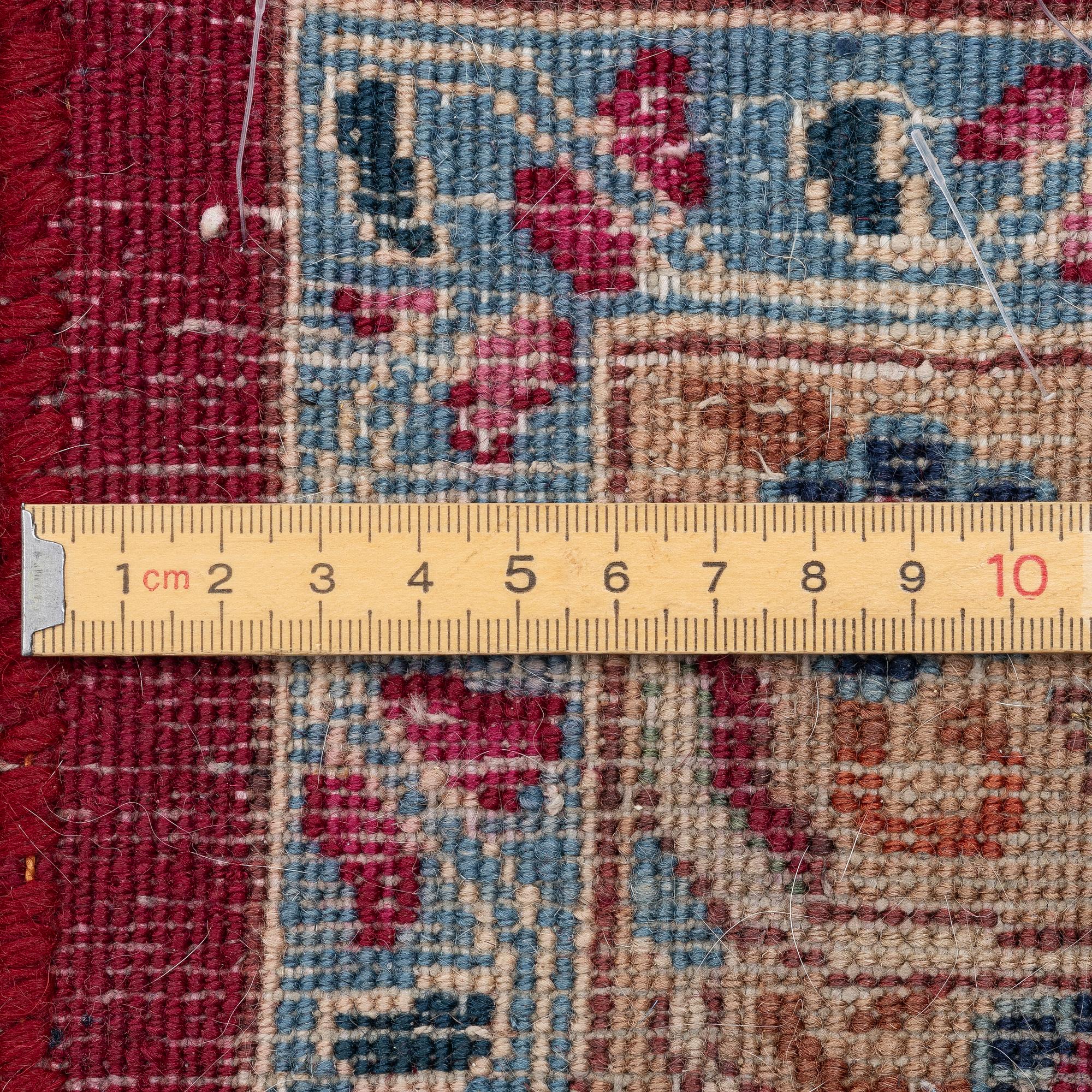 A oriental carpet, c. 375 x 290 cm.