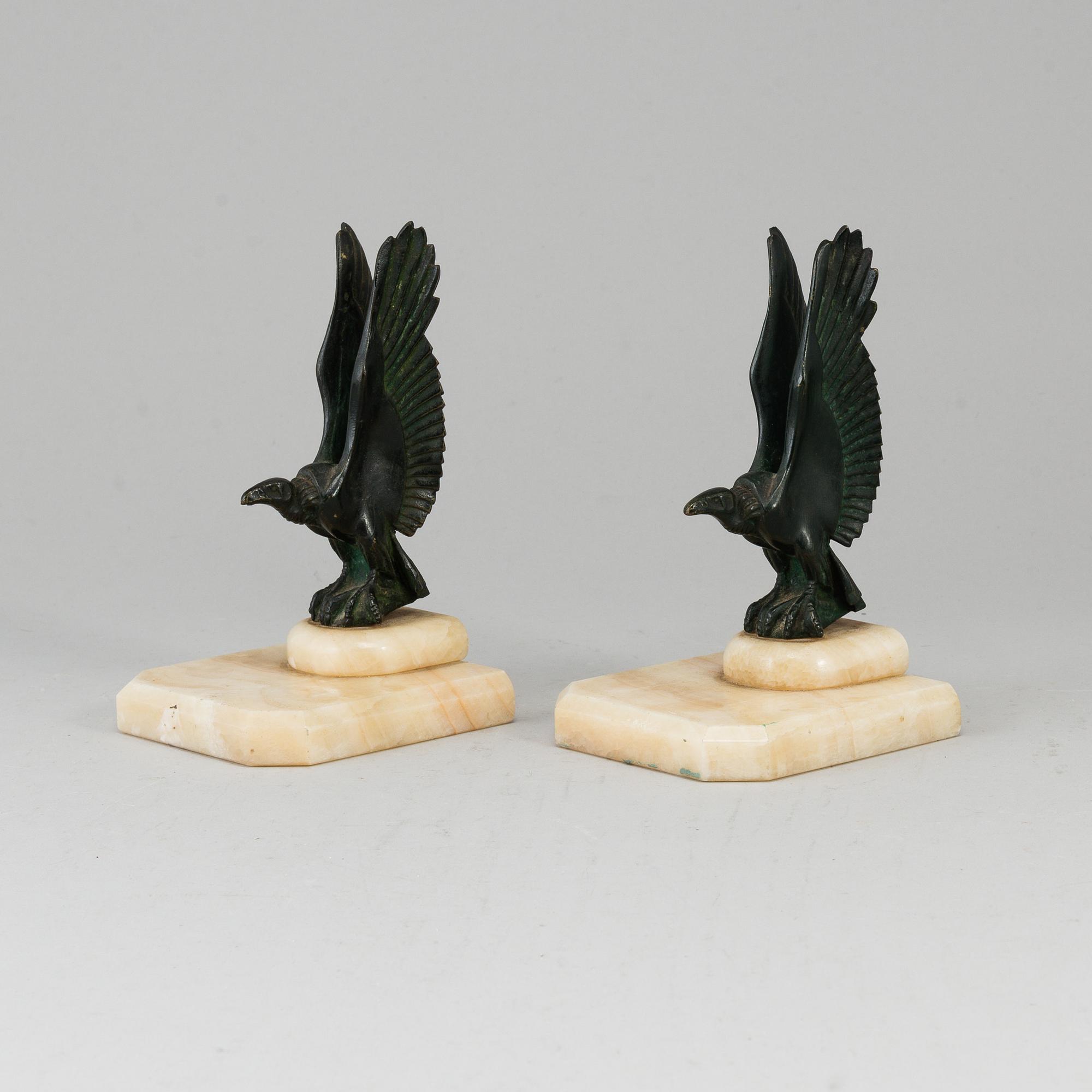 A pair of art déco marble and bronze book ends, 1930s.
