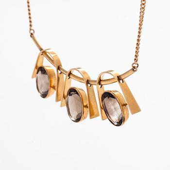 Eero Rislakki, halssmycke, fasettslipade rökkvartser, 14K guld. Westerback, 1960.
