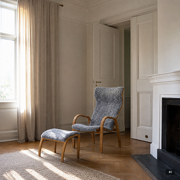 Jan Ekström, armchair with footstool "Gazelle", Conform, 21st century.