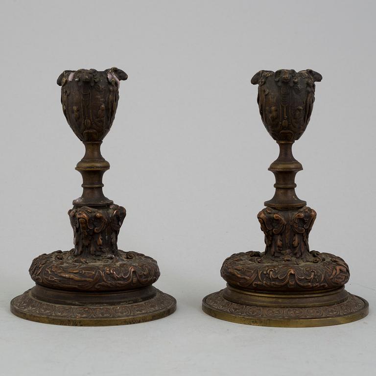 A PAIR OF BRONZE CANDLESTICKS, mid 19th century.