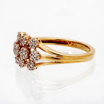 An 18K gold ring with octagonal cut diamonds.