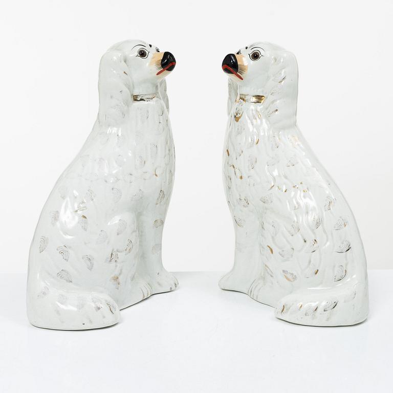 A pair of creamware glass-eyed Spaniels, Staffordshire, England, Victorian (1837-1901).