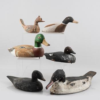 A set of six wooden duck decoys, 20th century.