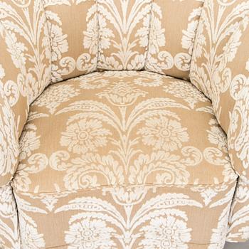 A pair of mid-20th century armchairs.