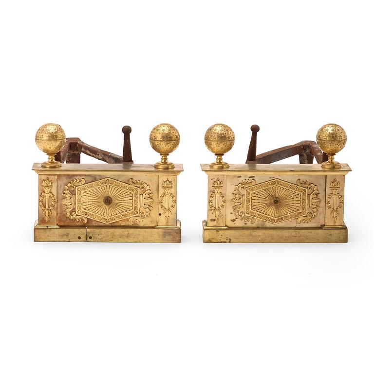 Empire, A pair of French Empire early 19th century gilt bronze chenets.