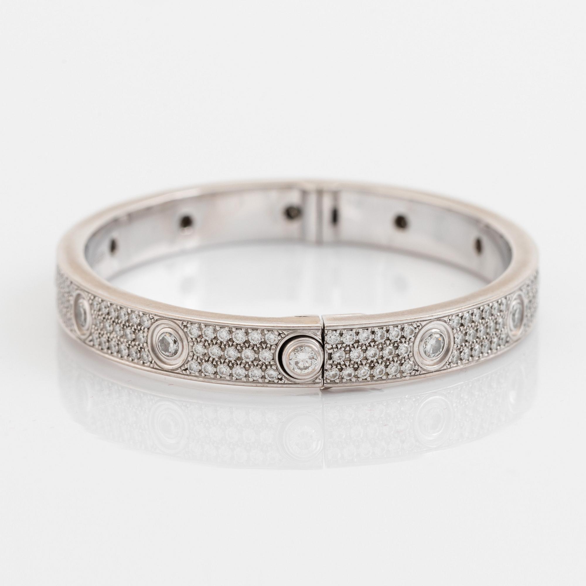 A Cartier "Love" bracelet in 18K white gold set with round brilliant-cut diamonds.