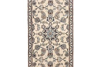 A Nain runner carpet, part silk, c. 298 x 80 cm.