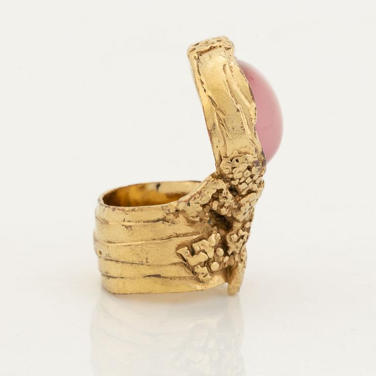 An Yves Saint Laurent ring.