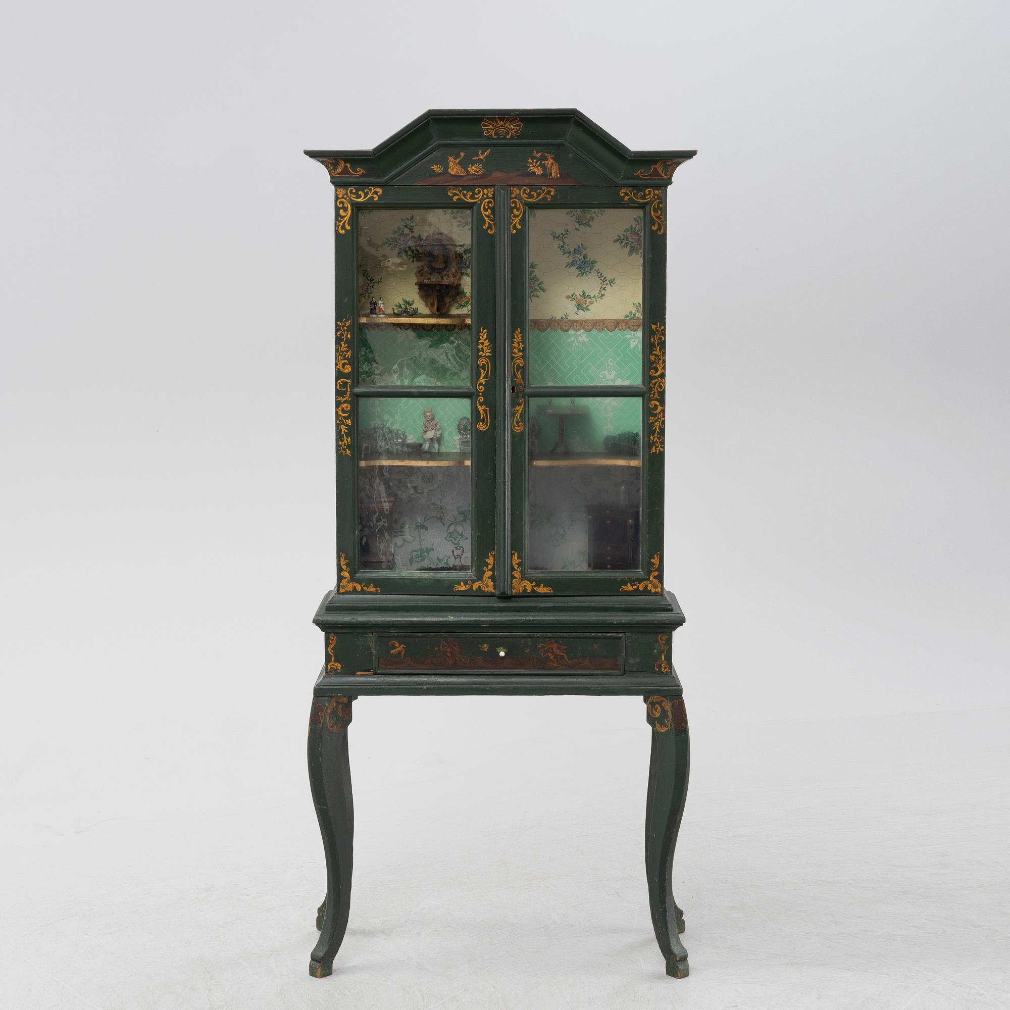 An 18th century cabinet / doll's house.