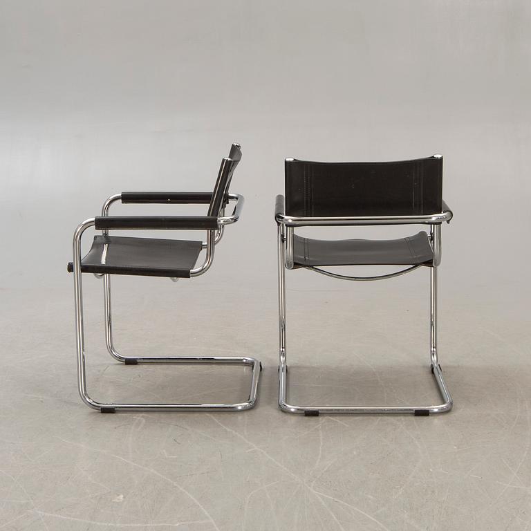 A pair of chrome and leather armchairs lat er part of the 20th century.