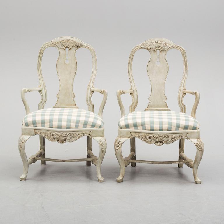 A pair of 20th century rococo style armchairs.