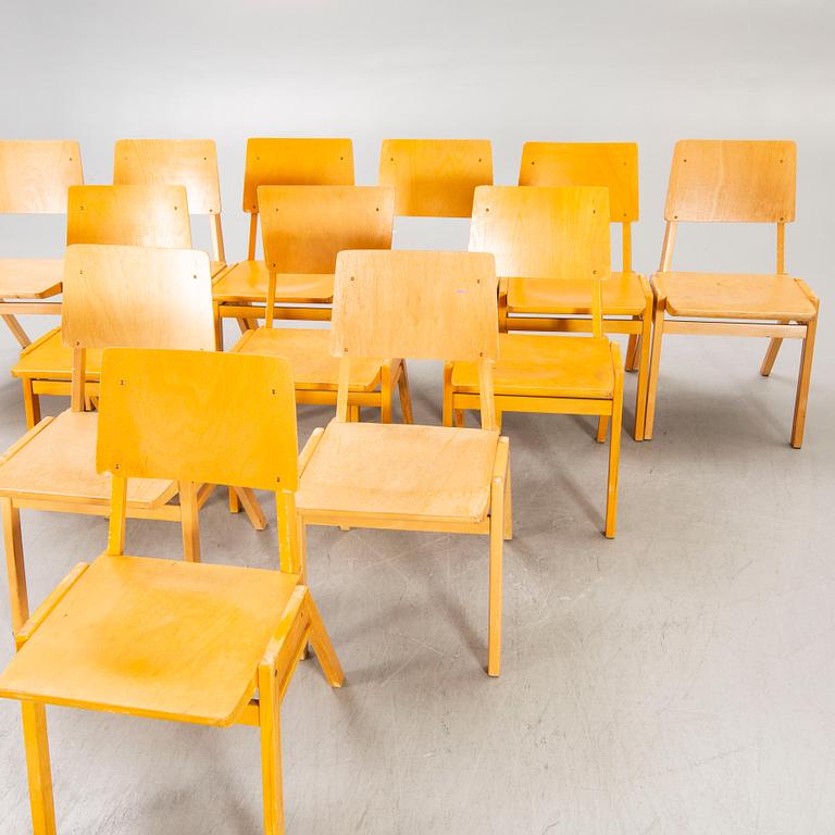 A set of 12 beech stackable chairs mid 1900s.