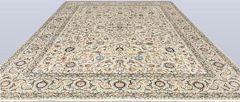 A Keshan carpet, signed, approx. 410 x 323 cm.