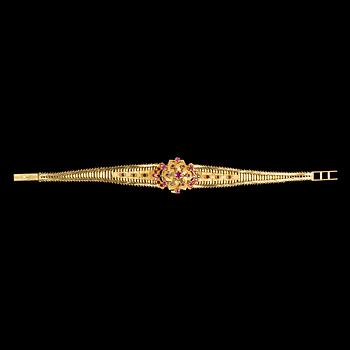 LADIES WRIST WATCH, Longines, gold and rubies.