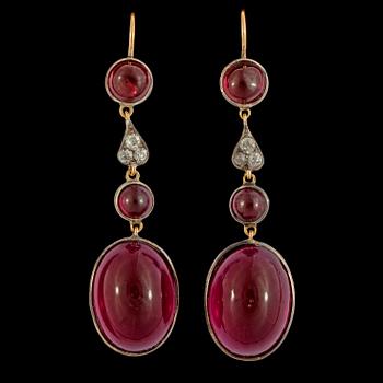 1155. A pair of garnet, red paste and diamond earrings.