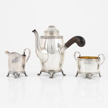 A Swedish Silver Coffee Pot, Creamer and Sugar Bowl, mark of CG Hallberg, Stockholm 1917-18.