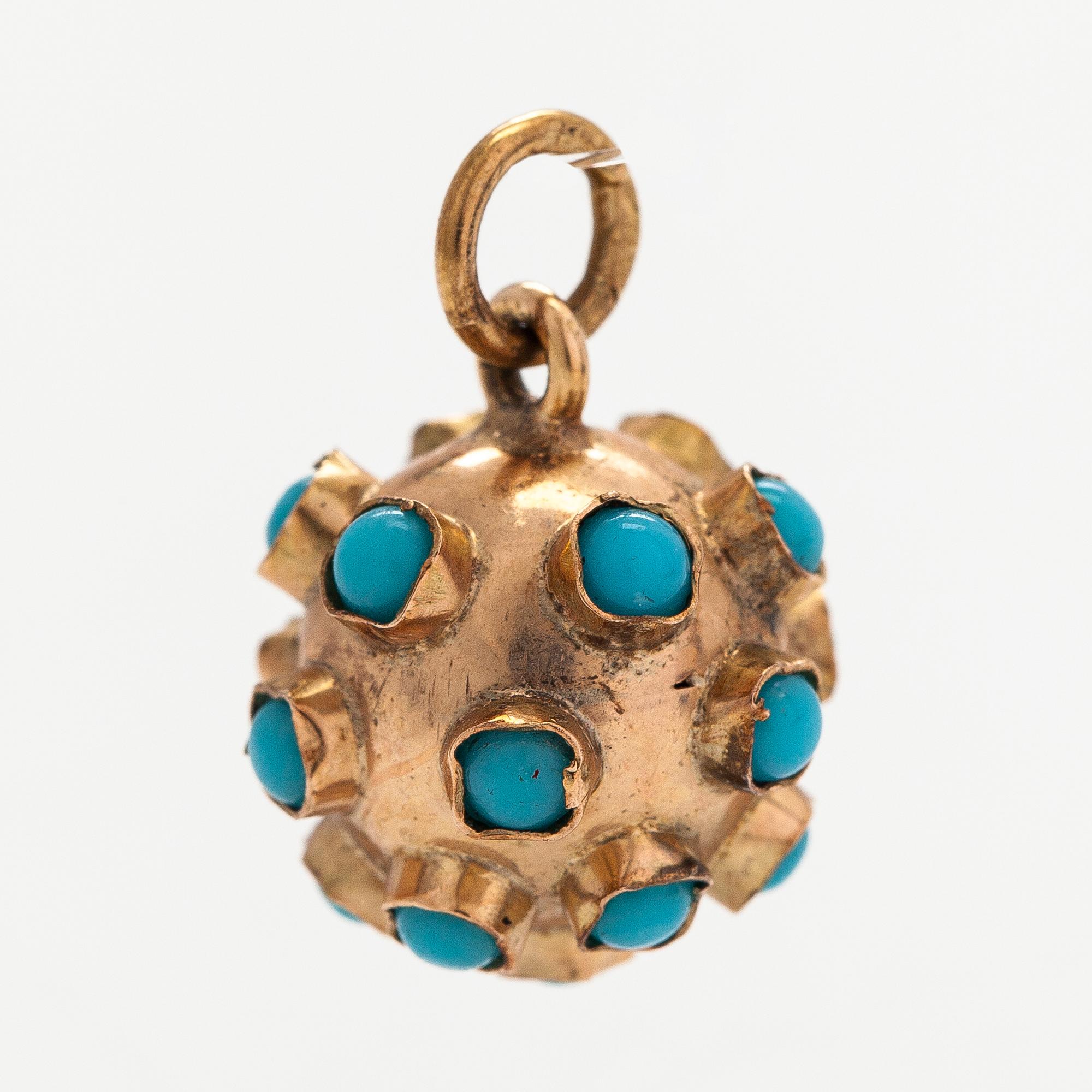 A 14K gold pendant with glass stones. Finnsh import marks.