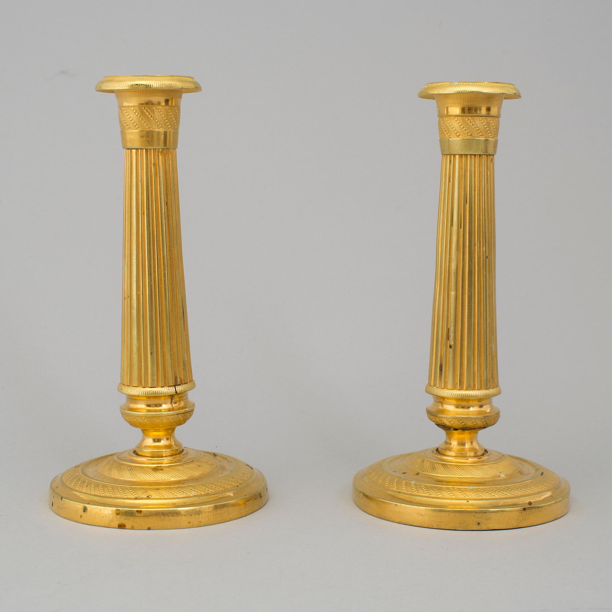 A PAIR OF EMPIRE CANDLESTICKS, first half of the 19th century.