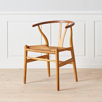 Hans J. Wegner, An early oak and teak 'Wishbone chair' by Carl Hansen & Son, Denmark, 1950's.