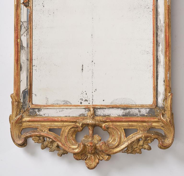 A Swedish Rococo mirror, 18 th century.
