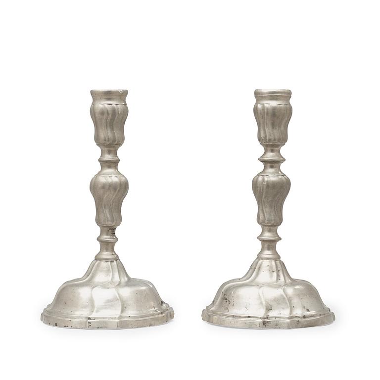 A pair of Swedish Rococo pewter candlesticks by F Ahlman 1777.