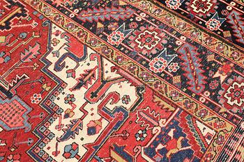 A semi-antique Heris carpet, approx. 343 x 260 cm.