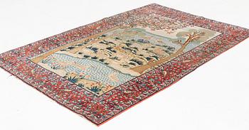 An antique/semi-antique pictoral Kashan rug, ca 215 x 140-144 cm.