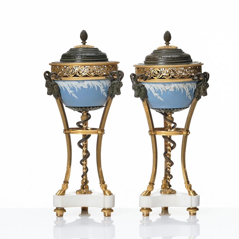 A pair of gilt bronze, marble and ceramic potpourri urns with covers, 19th century.