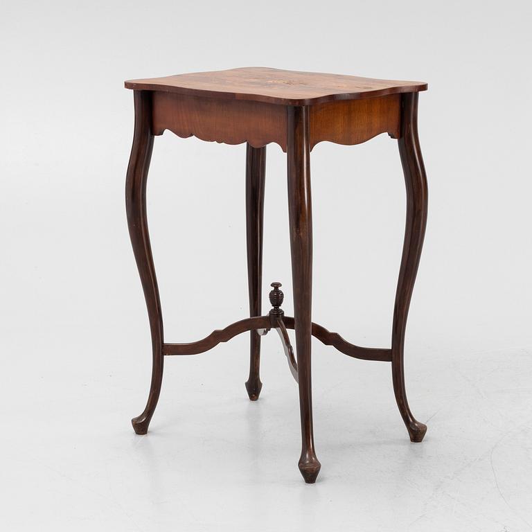 A Rococo style rosewood-veneered and mahogany sewing table, early 20th century.