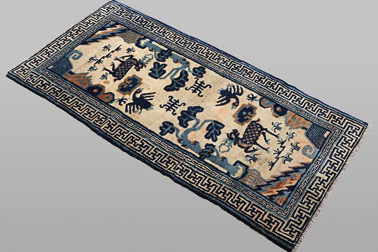 A rug, antique/semi-antique China, ca 125 x 60 cm.