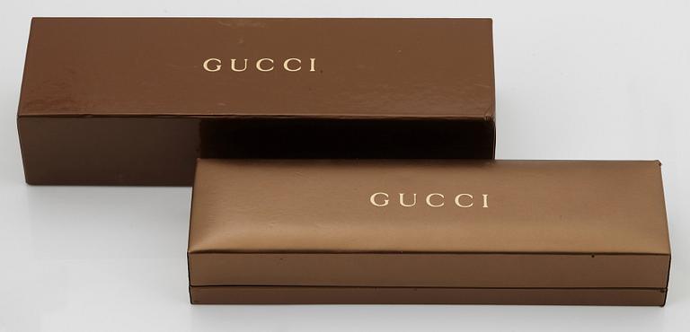 An 18K gold Gucci bracelet.